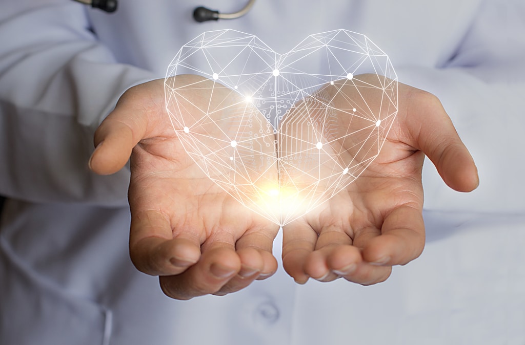 medical workers hands holding a heart shape