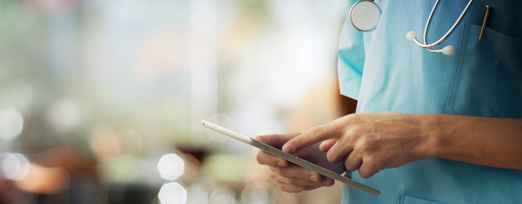 physician reviewing patient results on a tablet device